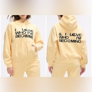 Peloton Cream Hoodie with Black Text